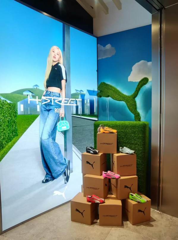 featuring faux-grass logo