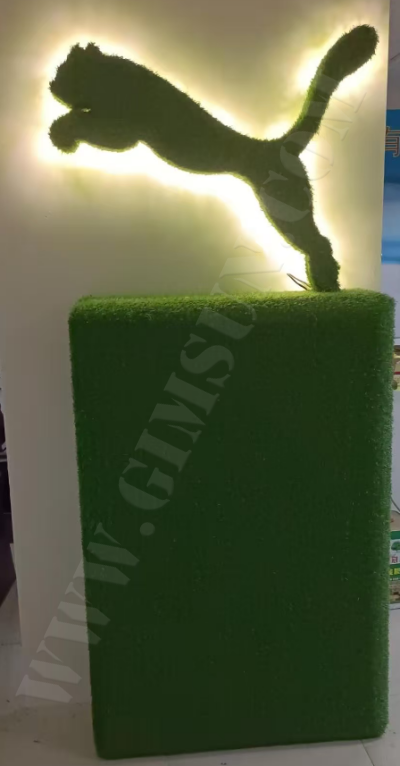 featuring faux-grass logo